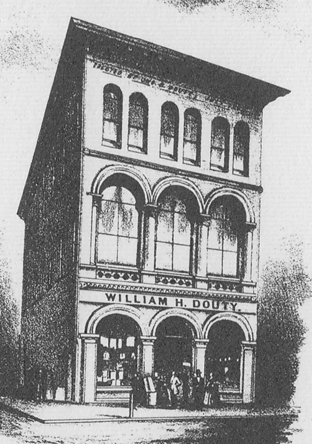 1873 architectural illustration of William H. Douty’s tall brown-stone-front building with arched windows and storefront