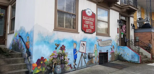 Celebration of the Arts mural with colorful figures and artistic imagery