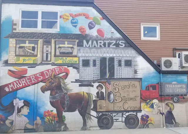 Colorful Shamokin Ice Cream Mural showing a historic delivery scene